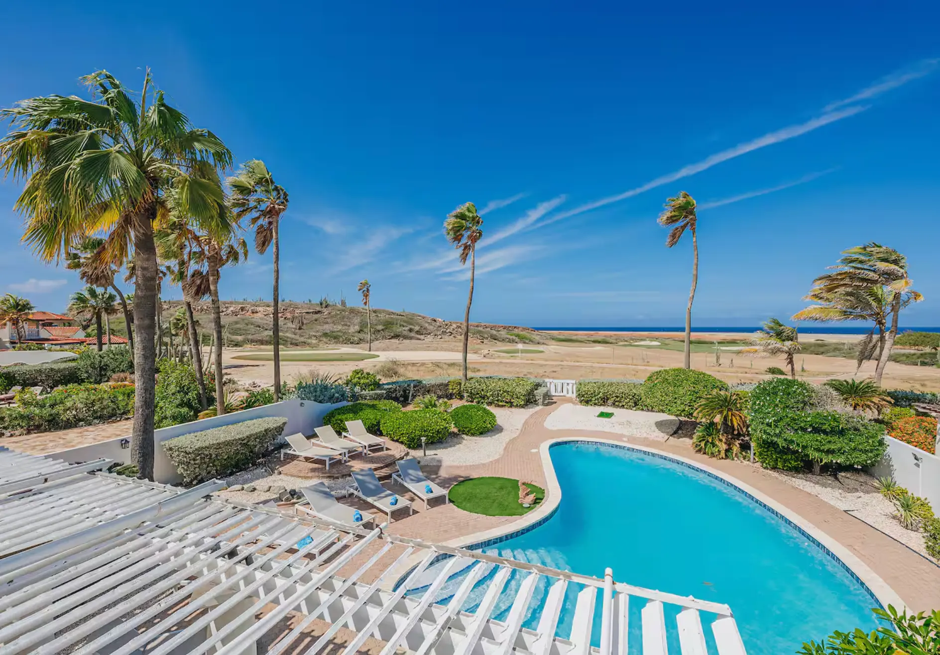 Pool and terrace looking out to the dunes and ocean
