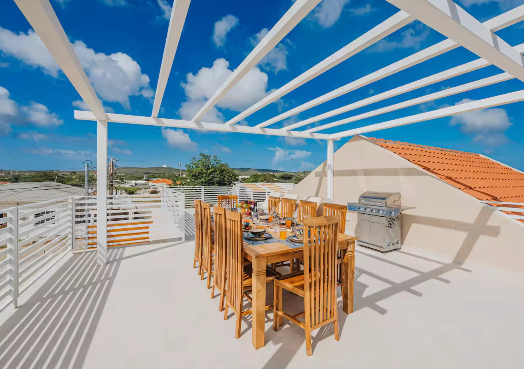 Rooftop pergola dining table set for a group