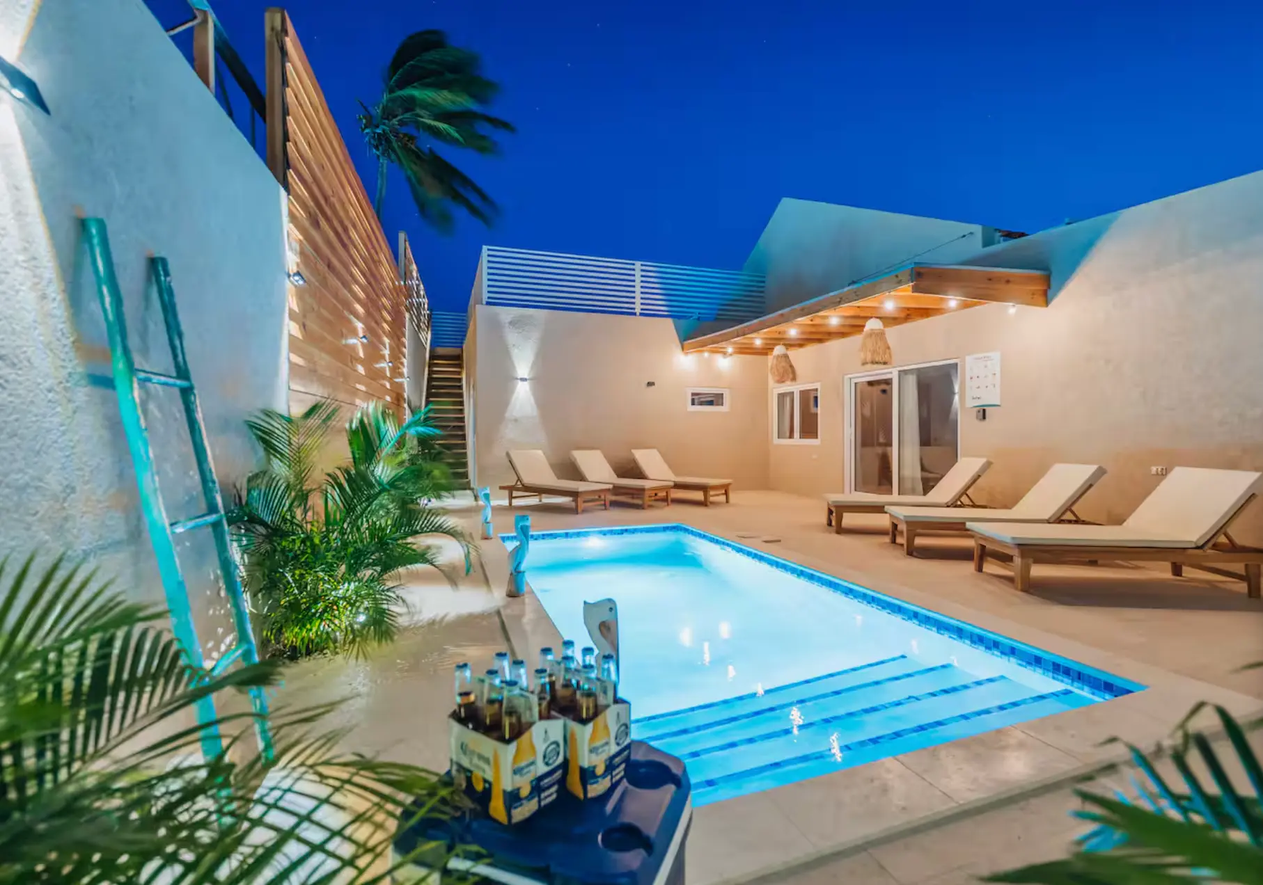 Villa courtyard pool lit at night